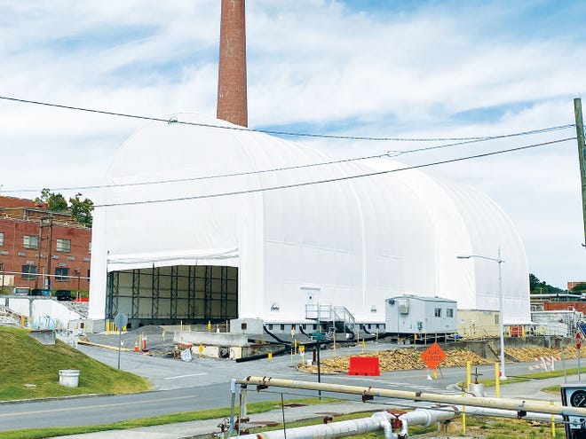 UCOR erected a six-story protective cover over the hot cells in the former Radioisotope Development Lab to ensure that nearby research facilities were not compromised during the hot cell demolition project.
